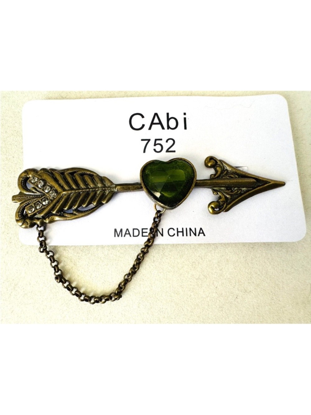 CAbi Brass-Tone Arrow Heart Pin with Olive Green Gem